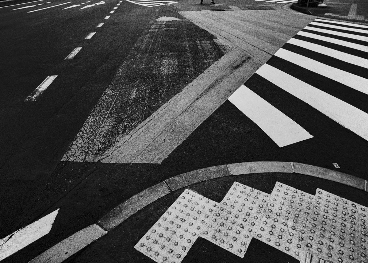 Road markings at a crossing.