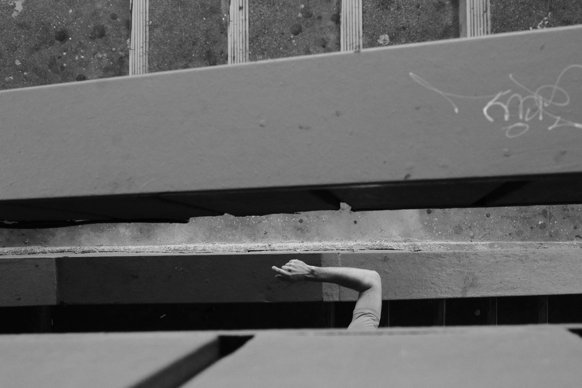 Arm through the railing. Galata Bridge.